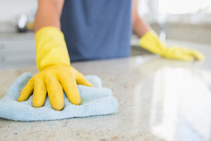 Stone Care Woman cleaning the counter